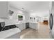 Open kitchen overlooking living room featuring an island and stainless appliances at 10865 Misty Moon Ct, Alpharetta, GA 30022