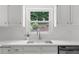 Bright kitchen featuring a stainless steel sink and window at 10865 Misty Moon Ct, Alpharetta, GA 30022