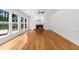 Living room featuring bamboo flooring, a ceiling fan, and a brick fireplace at 10865 Misty Moon Ct, Alpharetta, GA 30022