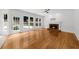 Hardwood floors and a fireplace in a living room with access to the outdoors at 10865 Misty Moon Ct, Alpharetta, GA 30022