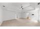 Large main bedroom with tray ceiling, ceiling fan and hallway at 10865 Misty Moon Ct, Alpharetta, GA 30022