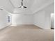 Spacious main bedroom with a tray ceiling and ceiling fan at 10865 Misty Moon Ct, Alpharetta, GA 30022