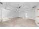 Large main bedroom with a tray ceiling leading into the bathroom at 10865 Misty Moon Ct, Alpharetta, GA 30022