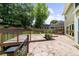 An outdoor patio, perfect for entertaining, is surrounded by lush greenery at 10865 Misty Moon Ct, Alpharetta, GA 30022
