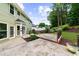 Spacious back patio features beautiful landscaping, perfect for outdoor living at 10865 Misty Moon Ct, Alpharetta, GA 30022