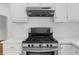 Close up of modern stainless steel kitchen stove at 10865 Misty Moon Ct, Alpharetta, GA 30022