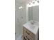 Modern bathroom featuring a glass-enclosed shower and updated vanity at 1850 Donald Dr, Marietta, GA 30062