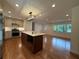 Open eat-in kitchen featuring a central island, stainless steel appliances, and hardwood floors at 1850 Donald Dr, Marietta, GA 30062