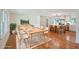 Open-concept living area with a dining table and a kitchen featuring a large island with bar seating at 1850 Donald Dr, Marietta, GA 30062