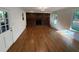 Cozy living room with a brick fireplace, natural lighting and hardwood floors at 1850 Donald Dr, Marietta, GA 30062