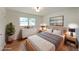 Comfortable bedroom featuring hardwood floors, a large window, and stylish decor at 1850 Donald Dr, Marietta, GA 30062
