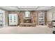 Finished basement with a stone fireplace and built-in shelving, perfect for cozy evenings at 217 Millbrook Farm Rd, Marietta, GA 30068