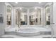 The bathroom showcases a deep soaking tub with marble surround and decorative columns at 217 Millbrook Farm Rd, Marietta, GA 30068