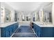 Luxury bathroom featuring dual vanities with marble countertops and elegant fixtures at 217 Millbrook Farm Rd, Marietta, GA 30068