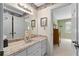 Bathroom with a long vanity, decorative wallpaper, and adjoining bedroom at 217 Millbrook Farm Rd, Marietta, GA 30068