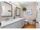 Bathroom featuring a granite countertop, white cabinets, and wood floors at 217 Millbrook Farm Rd, Marietta, GA 30068