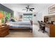 Bright bedroom featuring a ceiling fan, natural light, and an adjacent workspace, creating a functional and inviting area at 217 Millbrook Farm Rd, Marietta, GA 30068