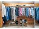 Organized walk-in closet with wooden shelving and ample storage space for clothes and accessories at 217 Millbrook Farm Rd, Marietta, GA 30068