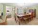 Elegant dining room with a wooden table, chandelier, and view into another room with light green paint at 217 Millbrook Farm Rd, Marietta, GA 30068