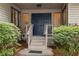 Front entrance featuring double doors and well-maintained landscaping at 217 Millbrook Farm Rd, Marietta, GA 30068