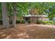 Charming single-story home featuring stone accents and mature trees in a serene setting at 217 Millbrook Farm Rd, Marietta, GA 30068