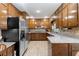 Updated kitchen featuring stainless steel appliances, granite countertops, and wooden cabinetry at 217 Millbrook Farm Rd, Marietta, GA 30068