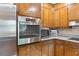 The kitchen is well-equipped, with granite countertops, stainless steel oven, microwave, and wood cabinets at 217 Millbrook Farm Rd, Marietta, GA 30068