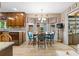 Cozy kitchen nook featuring wood floors, a bay window, and charming blue chairs at 217 Millbrook Farm Rd, Marietta, GA 30068