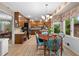 Sunlit kitchen nook boasts wood floors, a round table, and scenic views at 217 Millbrook Farm Rd, Marietta, GA 30068
