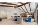 Open living room with vaulted ceilings, a stone fireplace, and access to the outdoor deck at 217 Millbrook Farm Rd, Marietta, GA 30068