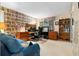 Spacious office with large desk, shelves, and a whimsical wallpaper design, perfect for working from home at 217 Millbrook Farm Rd, Marietta, GA 30068