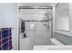 Modern shower showcasing sleek design, white subway tile, and glass door at 217 Millbrook Farm Rd, Marietta, GA 30068