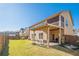 Spacious backyard featuring a covered patio and a well-maintained lawn at 2235 Well Springs Dr Dr, Buford, GA 30519