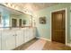 Bathroom with double sink vanity, granite countertops, and decorative ceiling at 2235 Well Springs Dr Dr, Buford, GA 30519