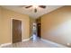 Empty bedroom with light wood flooring and a closed door to the hallway at 2235 Well Springs Dr Dr, Buford, GA 30519