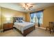 Carpeted bedroom with a large window and a traditional wood-framed bed set at 2235 Well Springs Dr Dr, Buford, GA 30519