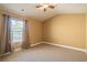 Cozy bedroom with a ceiling fan, plush carpet and window for plenty of natural light at 2235 Well Springs Dr Dr, Buford, GA 30519