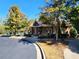 Community clubhouse with stone and timber detailing complemented by mature trees and landscaping at 2235 Well Springs Dr Dr, Buford, GA 30519