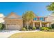 Charming two-story home featuring a stone facade, well-manicured lawn, and attached two car garage at 2235 Well Springs Dr Dr, Buford, GA 30519