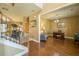 Open concept foyer with hardwood floors, staircase, and views into a living room and office space at 2235 Well Springs Dr Dr, Buford, GA 30519