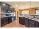 Stylish kitchen with stainless steel appliances, granite counters, mosaic backsplash, and pendant lighting at 2235 Well Springs Dr Dr, Buford, GA 30519