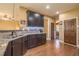 Charming kitchen area showcasing granite countertops, stainless steel sink, and dark wood cabinets at 2235 Well Springs Dr Dr, Buford, GA 30519