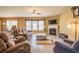 Inviting living area with fireplace, tile floors, large windows, and comfortable seating at 2235 Well Springs Dr Dr, Buford, GA 30519