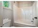 Bathroom featuring a large tub and shower combination at 65 Orchard Dr, Covington, GA 30014