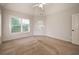 Neutral bedroom with carpet, ceiling fan and a door to the outside at 65 Orchard Dr, Covington, GA 30014