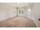 Neutral bedroom with carpet, ceiling fan and two windows at 65 Orchard Dr, Covington, GA 30014