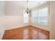 Elegant dining room featuring natural lighting, hardwood floors, and crown molding at 65 Orchard Dr, Covington, GA 30014