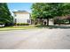 Beautiful two-story home with a lush lawn and driveway at 65 Orchard Dr, Covington, GA 30014