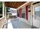 Welcoming front porch with a classic porch swing and neutral siding at 65 Orchard Dr, Covington, GA 30014