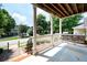 Inviting front porch with a porch swing, perfect for relaxing outdoors at 65 Orchard Dr, Covington, GA 30014